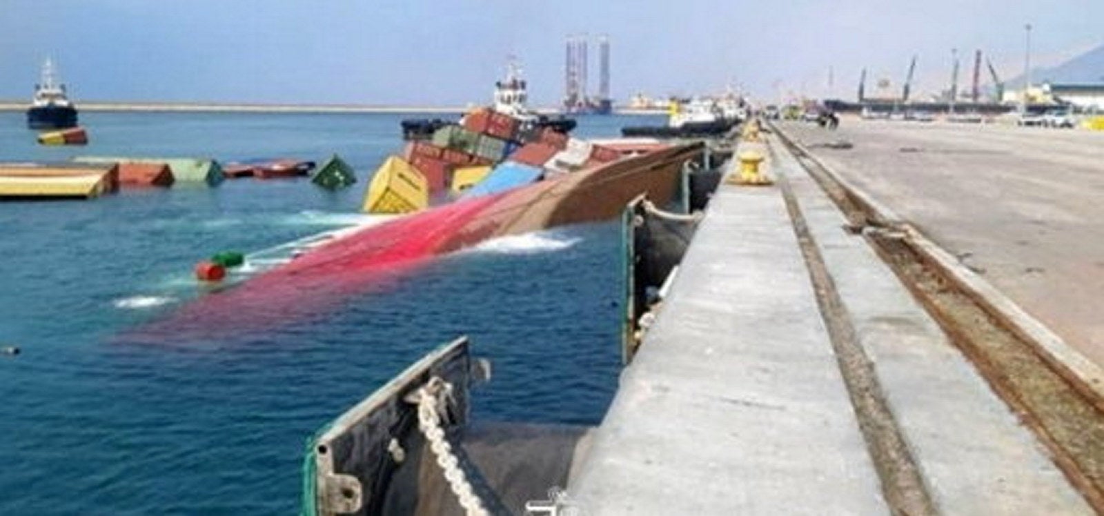 Boxes float free as container ship capsizes and sinks in Iran