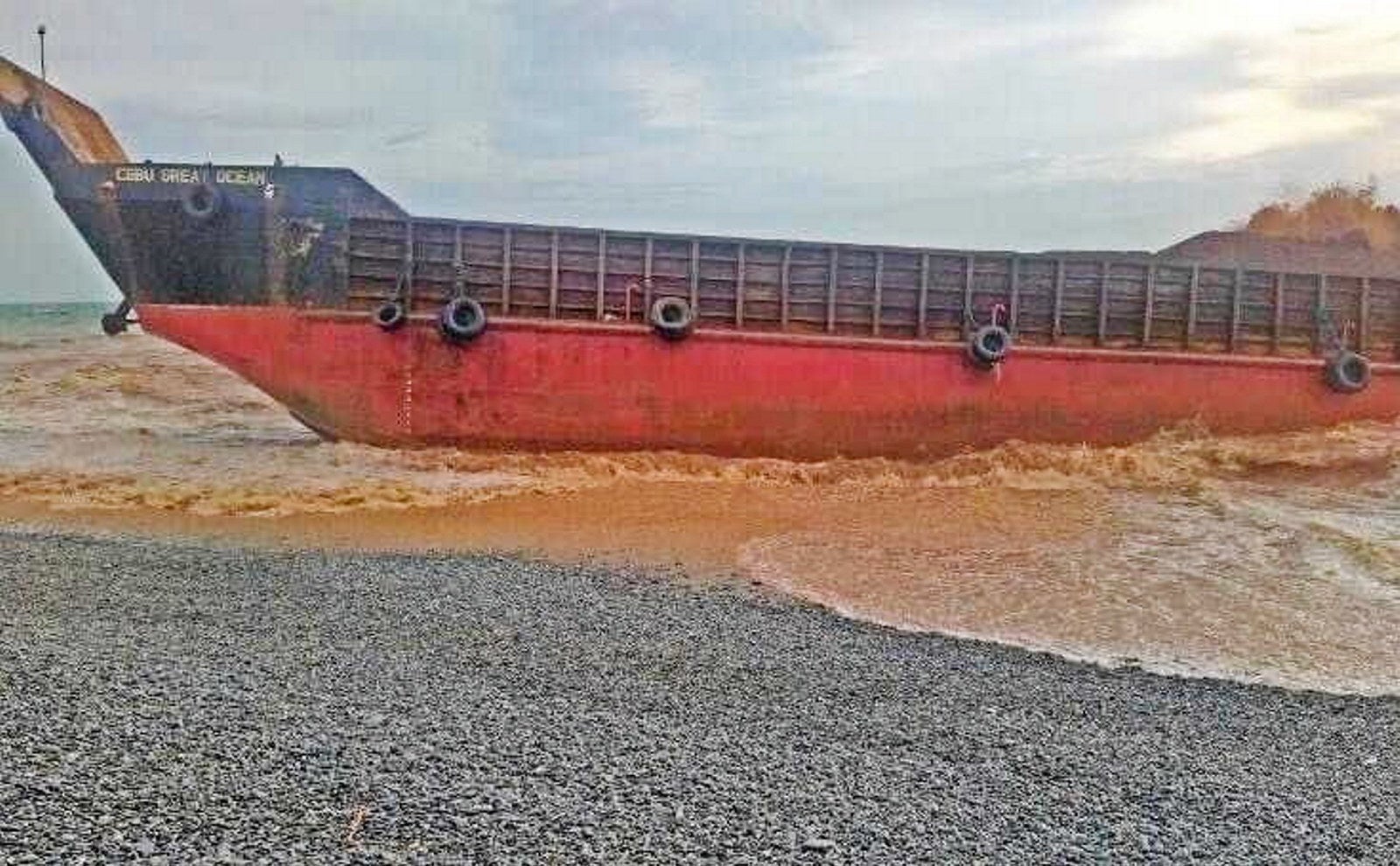 Three killed and nine missing after ship grounds in Philippines typhoon