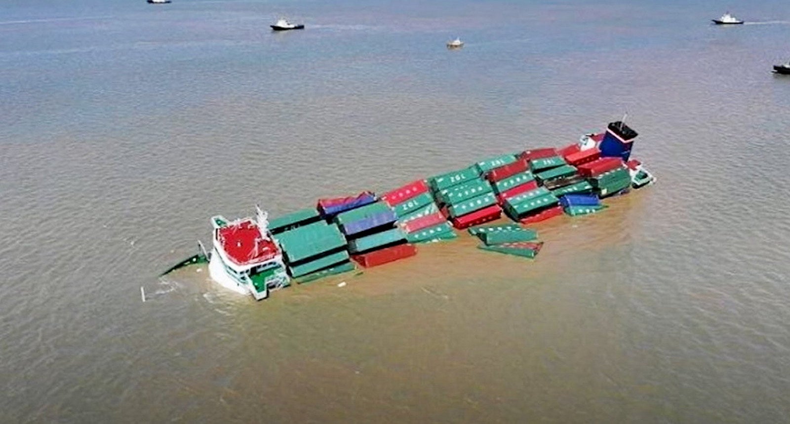 Video: Crew evacuated as container ship partially sunk in collision off ...