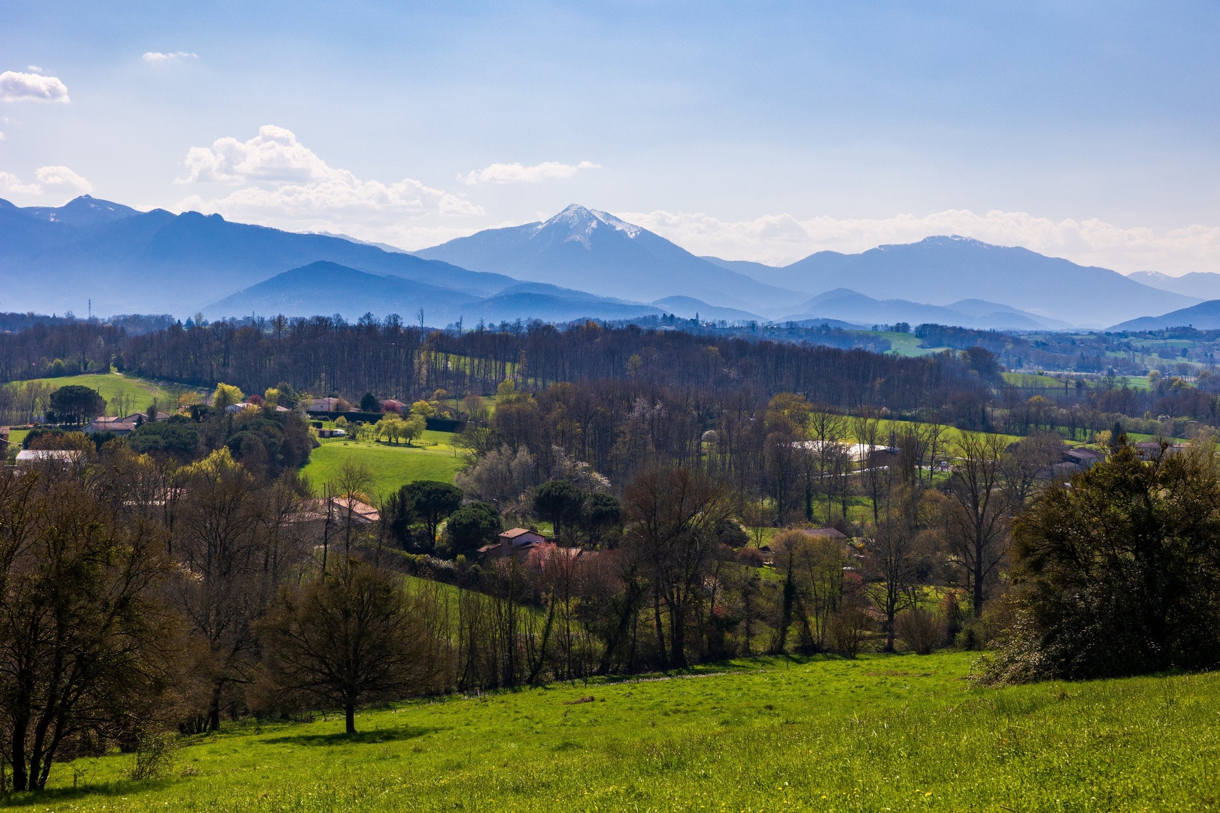 A view of the Comminges countryside in southern France, where the permit applies, with snow-capped mountains of the Pyrenees in the distance.